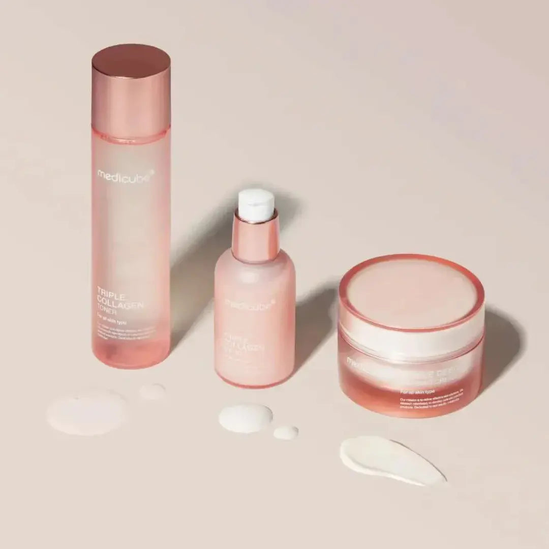 Layered routine flatlay — toner, serum, cream for hydration, elasticity and glow
